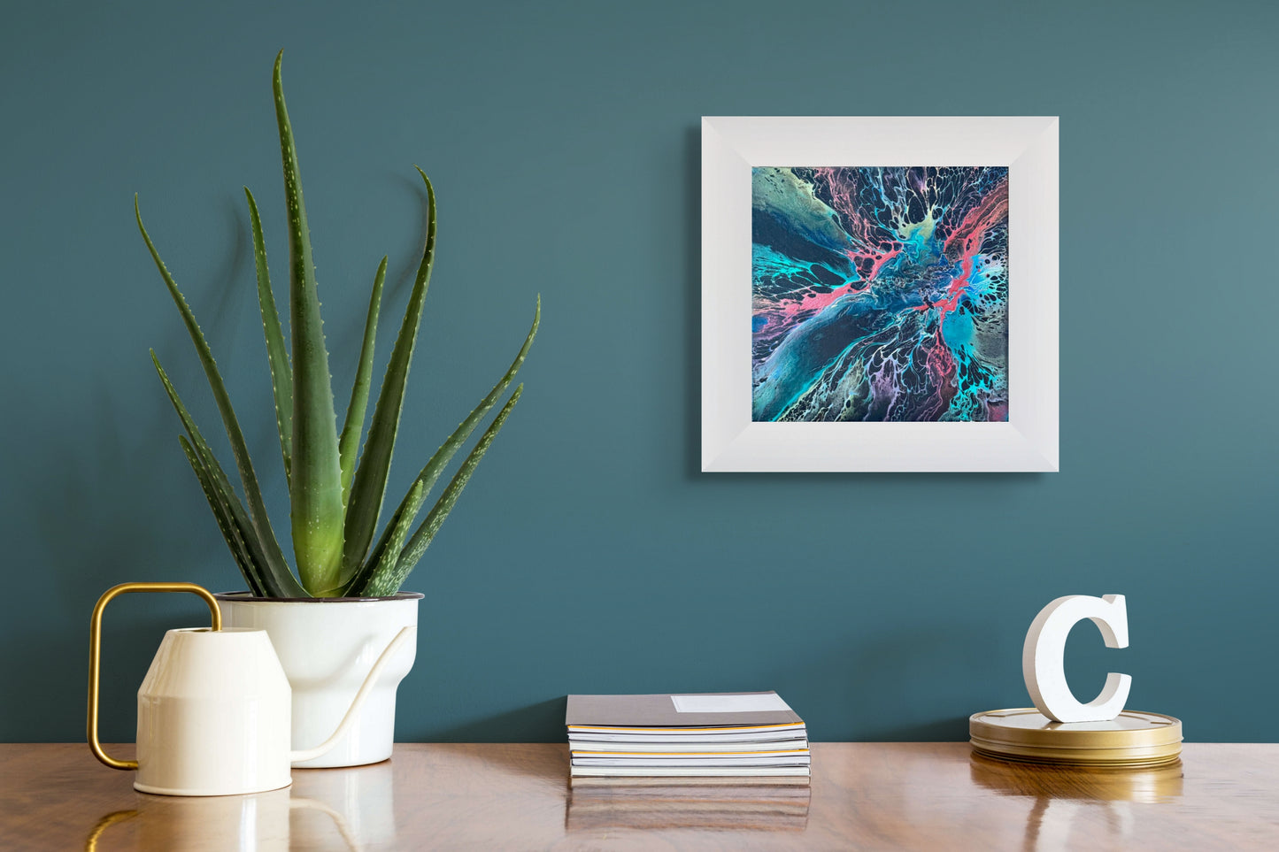 Acrylic Pour painting in the pearl process. 12 x 12 inches finished in resin. Prussian Blue background with red pigment, turquoise, and submarine yellow. The painting has a light natural feel perfect for any small space or accompaniment to other artwork.